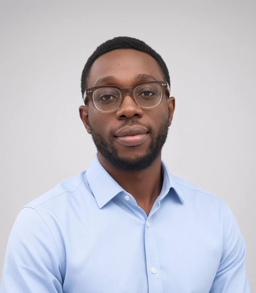 Professional studio portrait of a visionary African tech founder in a modern office setting. The founder is wearing a sharp, contemporary suit, looking confidently at the camera. The background is a clean, minimalist workspace with soft ambient lighting and subtle purple accents, reflecting the brand's sophisticated and high-tech identity. The mood is one of leadership, innovation, and trust.